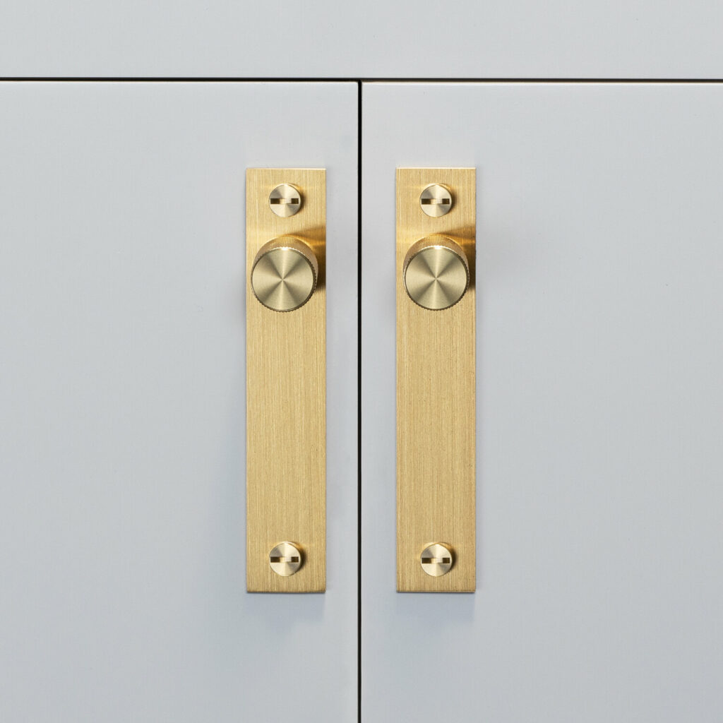 2. Furniture knob_plate_cross_brass_front