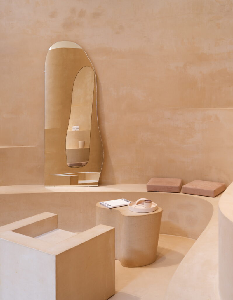 Fine-grained mixtures of clays and mineral binders TerraTon Floor and TerraTon Plus Wall both Smooth and with the same bespoke color applied to floor, walls and shelves of Jaquemus boutique into the London Slefridges. Project by AMO-OMA. Photo by Lewis Ron