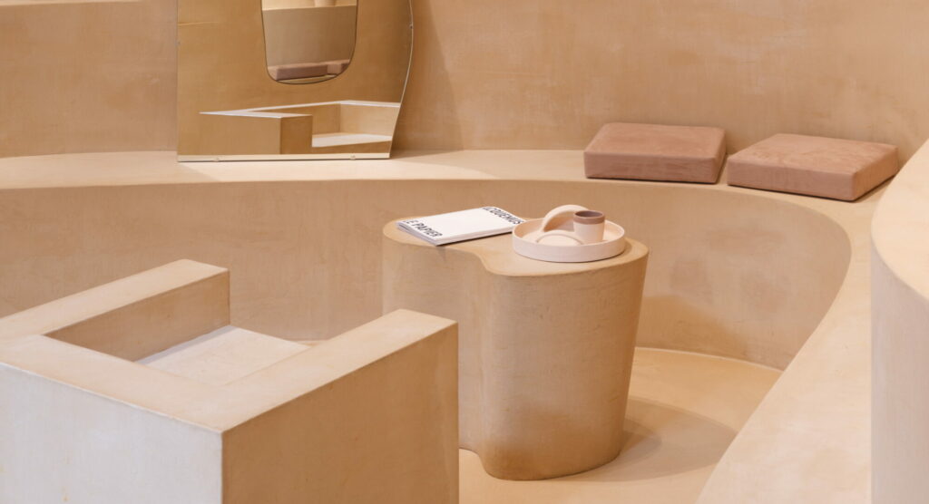 Fine-grained mixtures of clays and mineral binders TerraTon Floor and TerraTon Plus Wall both Smooth and with the same bespoke color applied to floor, walls and shelves of Jaquemus boutique into the London Slefridges. Project by AMO-OMA. Photo by Lewis Ron