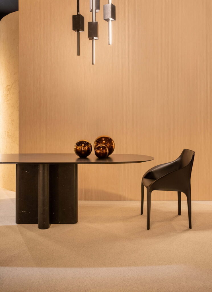 Very coarse-grained clay finishing MultiTerra Structured, bespoke raw earth grooved-work decoration TerraEvoca, all applied to walls of Trussardi Casa display at Milan Furniture Fair in a Panna (cream) color shade. Design and photo by Luxury Living Group